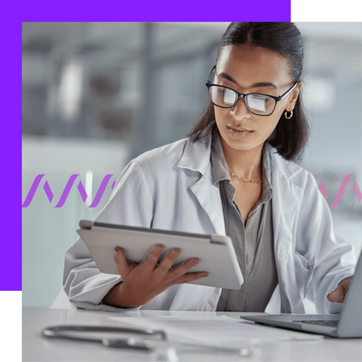 Key Tech Challenges for Healthcare Image of a woman wearing a white coat and looking at a table screen