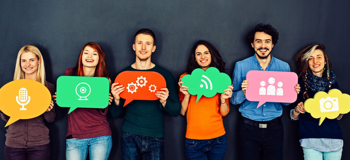 Photo of people holding icon signs