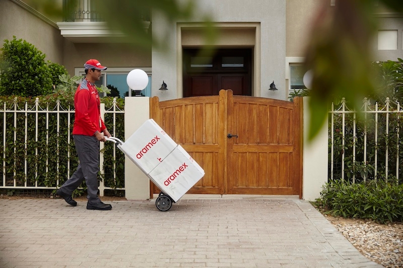 Aramex delivery person delivering packages